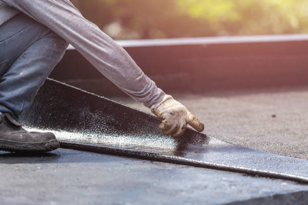 Professional Basement Waterproofing technician working in Beaverton, MI